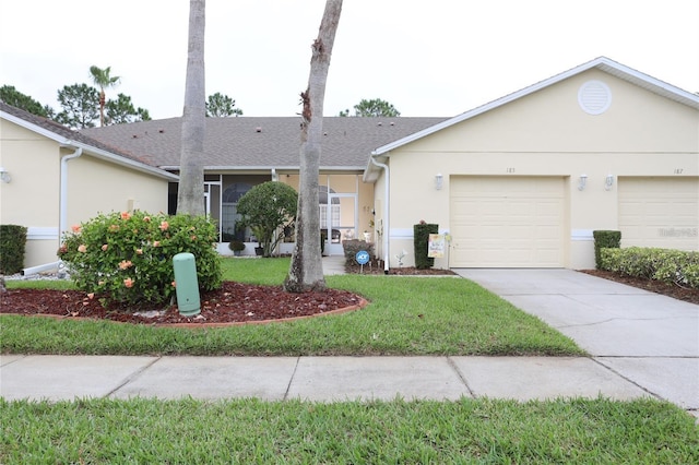 single story home featuring stucco siding, concrete driveway, a front lawn, and roof with shingles