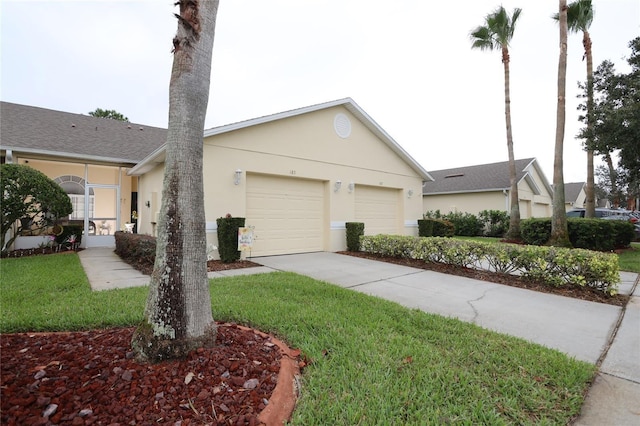 view of front facade with stucco siding, concrete driveway, and a garage