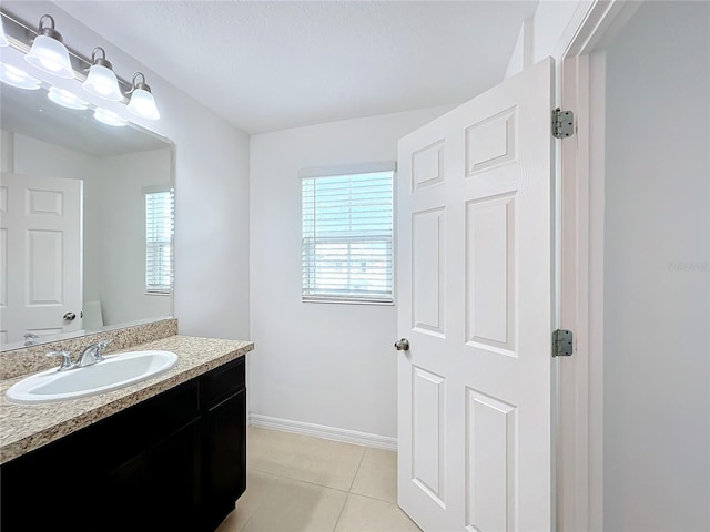 bathroom with tile patterned floors, toilet, and vanity