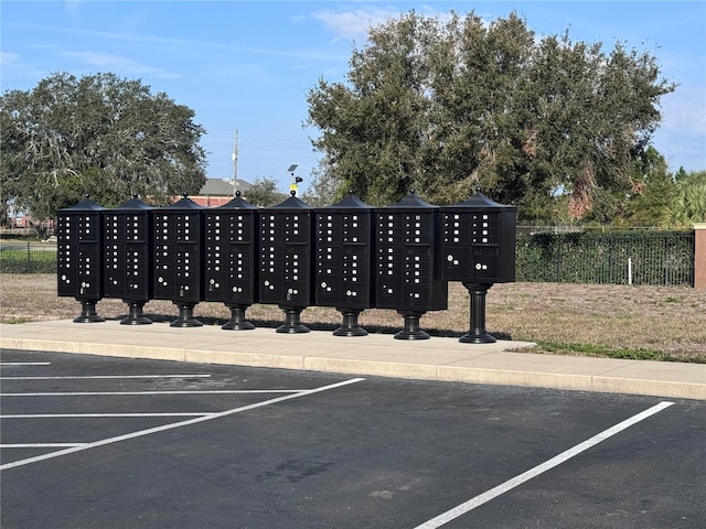 view of parking / parking lot featuring mail boxes