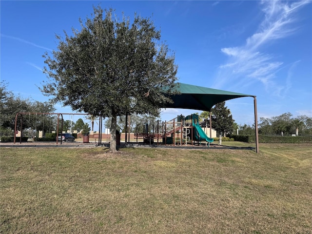 view of jungle gym featuring a lawn