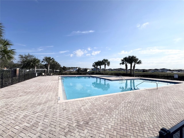 view of swimming pool featuring a patio