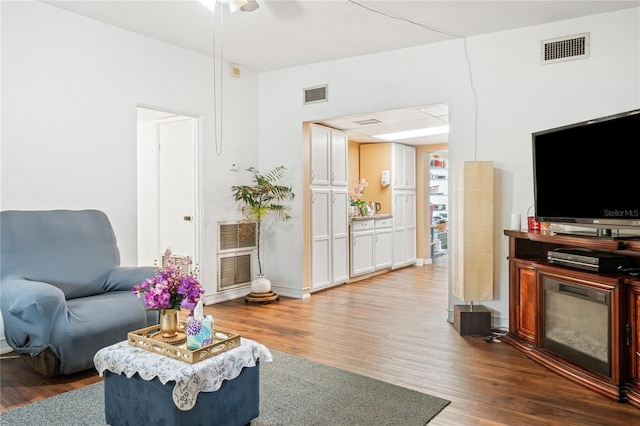 living room with dark hardwood / wood-style floors