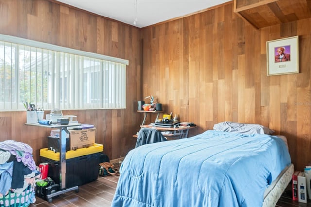 bedroom featuring wood walls