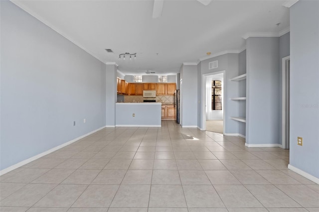 unfurnished living room featuring built in features, rail lighting, light tile patterned floors, ceiling fan, and crown molding