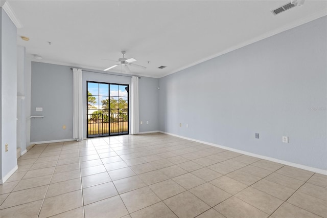 tiled spare room featuring crown molding and ceiling fan