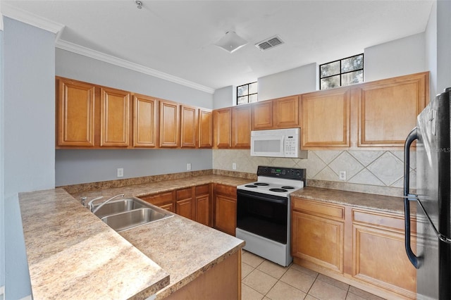 kitchen with sink, black fridge, light tile patterned floors, electric range, and kitchen peninsula