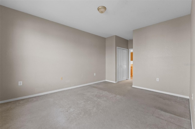 empty room with light colored carpet