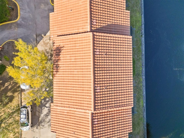 birds eye view of property with a water view