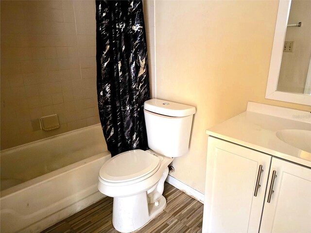 1091 S Hiawassee Rd Unit 216, Orlando, FL 32835 - full bathroom with vanity, wood finished floors, toilet, and shower / bathtub combination with curtain