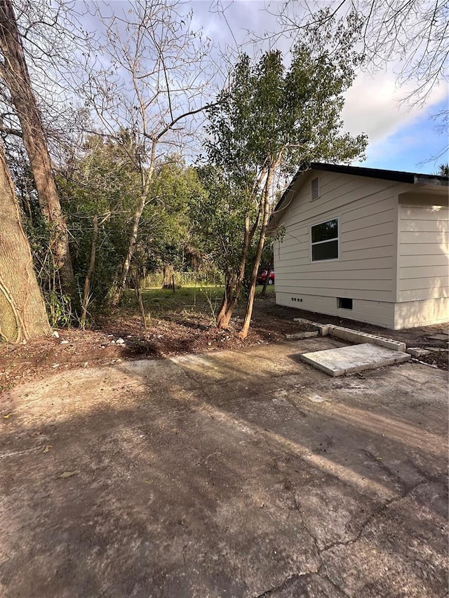 view of side of home featuring crawl space