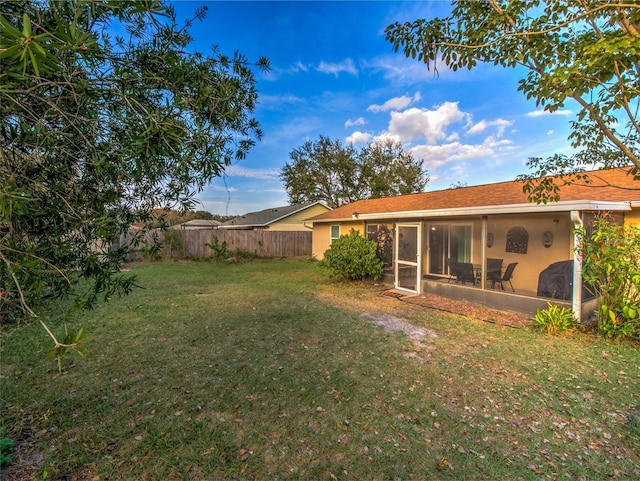 view of yard with a sunroom