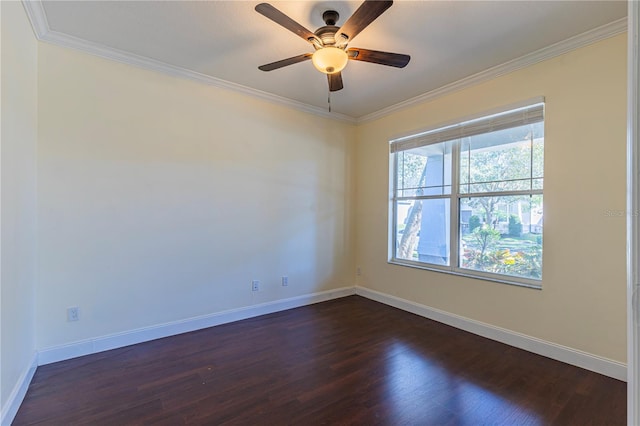 spare room featuring crown molding, dark wood-type flooring, and ceiling fan