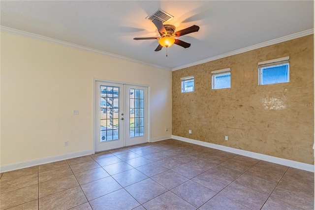 spare room with french doors, ceiling fan, crown molding, and light tile patterned flooring