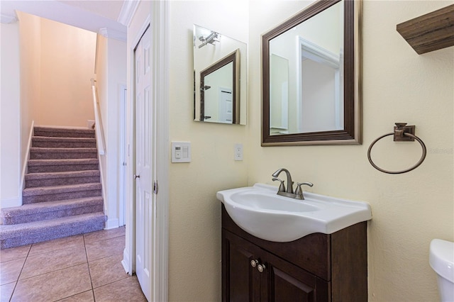 bathroom with tile patterned floors, toilet, and vanity