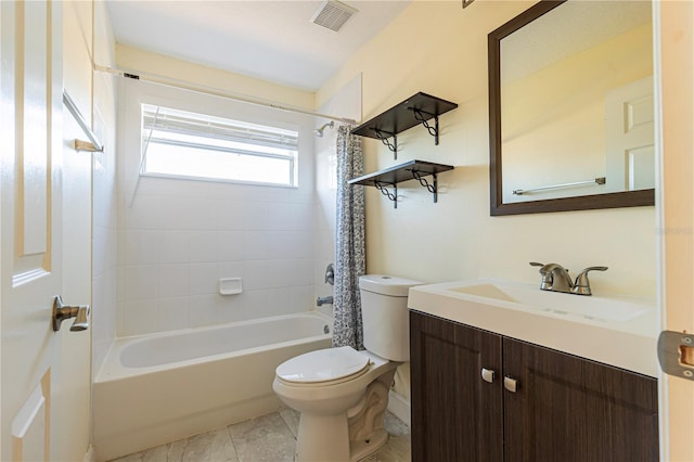 full bathroom with vanity, toilet, tile patterned flooring, and shower / tub combo