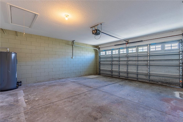 garage featuring a garage door opener and water heater