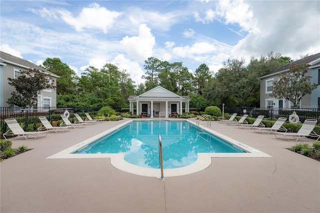 view of swimming pool featuring a patio area