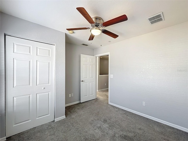 unfurnished bedroom with ceiling fan and carpet flooring