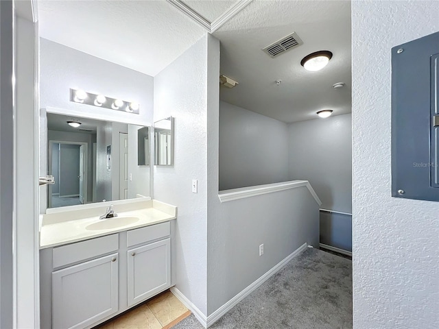 bathroom with vanity and a textured ceiling