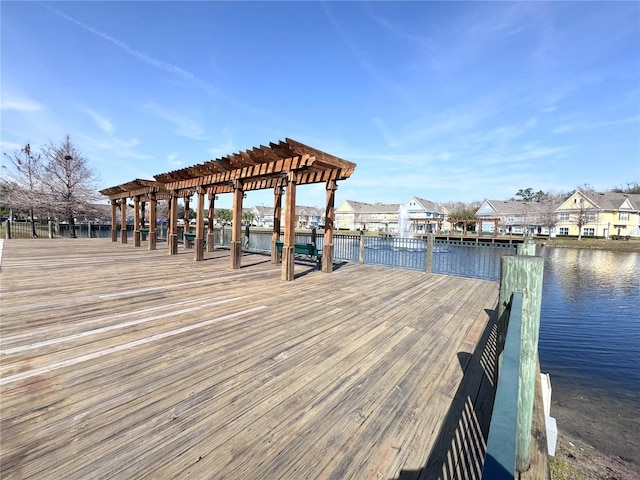 view of dock with a water view and a pergola