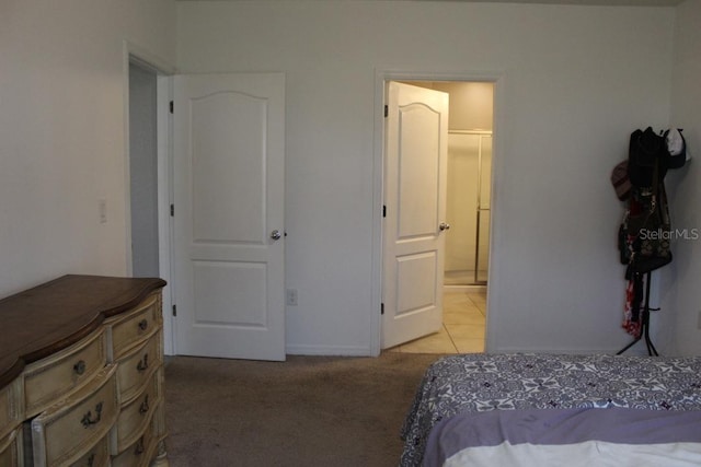 carpeted bedroom with connected bathroom