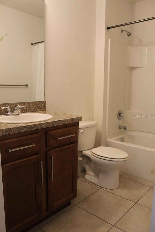 full bathroom featuring tile patterned flooring, vanity, shower / bath combo, and toilet