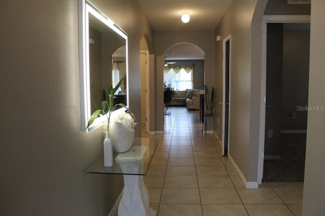 hall with light tile patterned floors