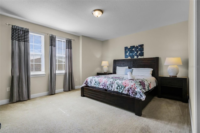 carpeted bedroom with a textured ceiling