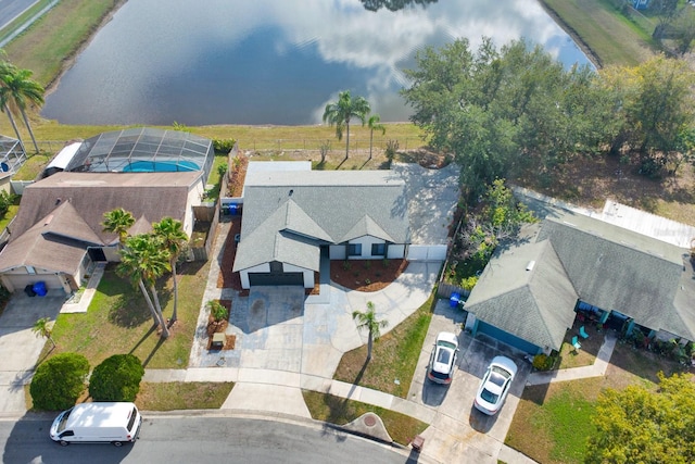 birds eye view of property with a water view