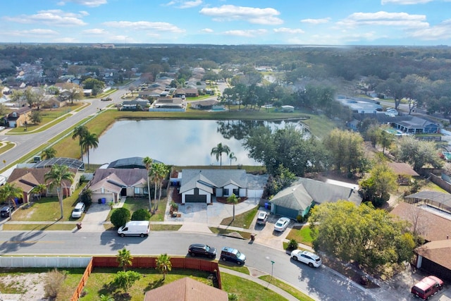 bird's eye view with a water view and a residential view