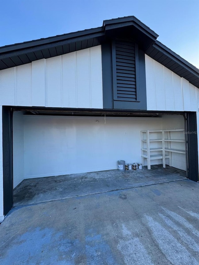 view of property exterior with a garage and board and batten siding