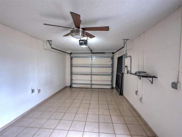 garage with a garage door opener and ceiling fan