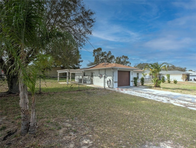 single story home featuring a garage and a front lawn