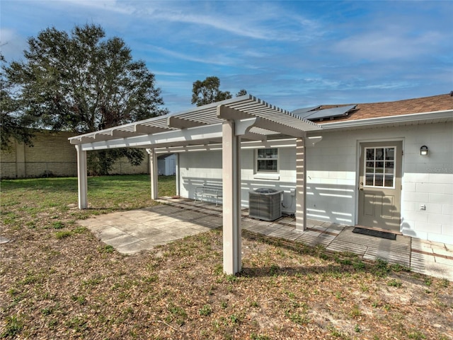 view of yard with cooling unit, a pergola, and a patio