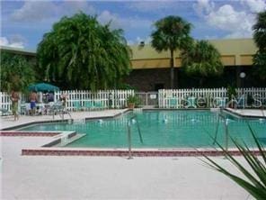 view of swimming pool featuring a patio area