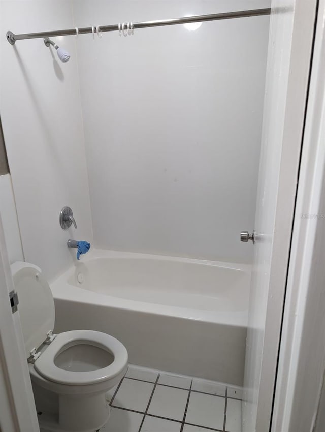 bathroom featuring tile patterned floors, toilet, and shower / bath combination