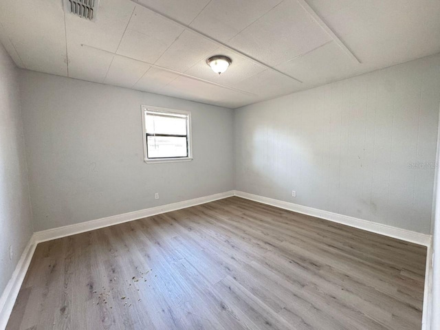 unfurnished room featuring wood-type flooring