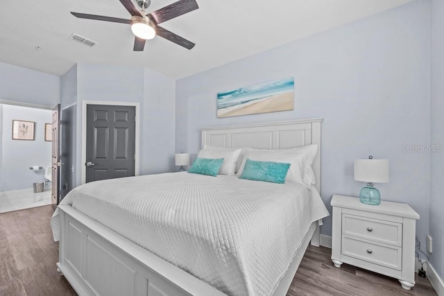 bedroom featuring dark wood-type flooring and ceiling fan