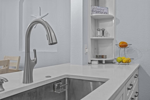 kitchen with sink and white cabinets