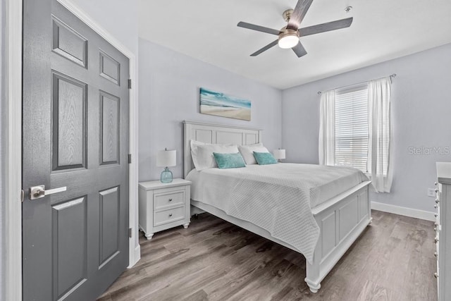 bedroom featuring wood-type flooring and ceiling fan