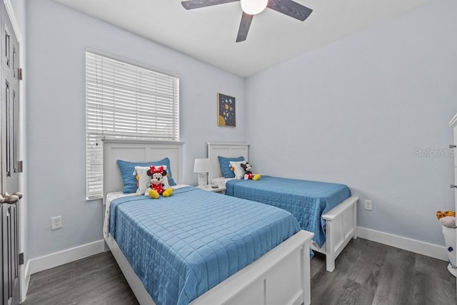 bedroom with dark wood-type flooring and ceiling fan