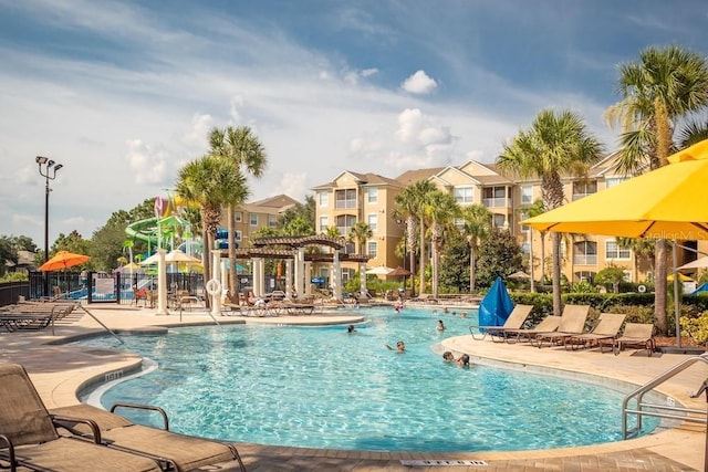 view of pool with a pergola and a patio area