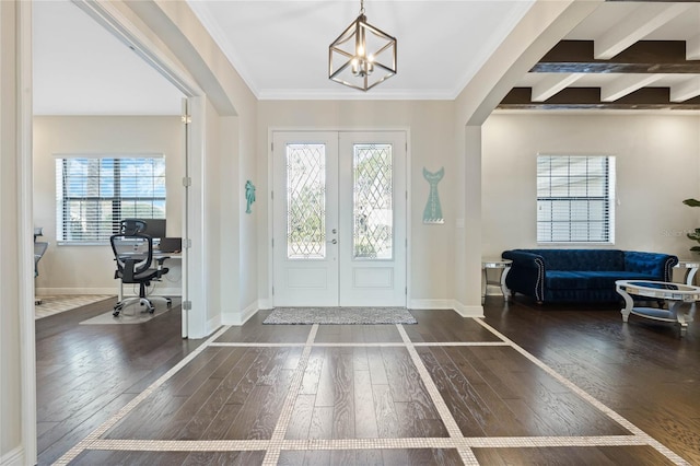 entrance foyer featuring french doors, wood-type flooring, a wealth of natural light, and crown molding