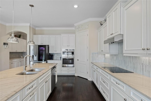 kitchen with stainless steel appliances, white cabinetry, a sink, and under cabinet range hood