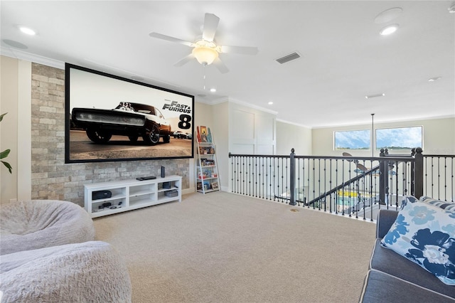 carpeted living room featuring ceiling fan, ornamental molding, visible vents, and recessed lighting