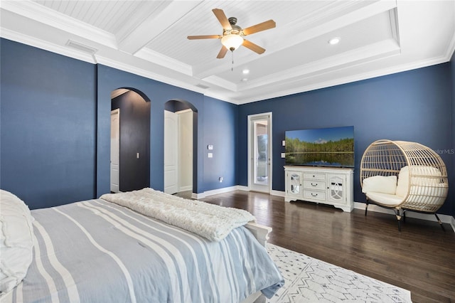 bedroom with arched walkways, ornamental molding, wood finished floors, beamed ceiling, and baseboards