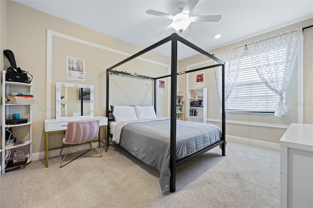 bedroom featuring carpet floors, a ceiling fan, and baseboards