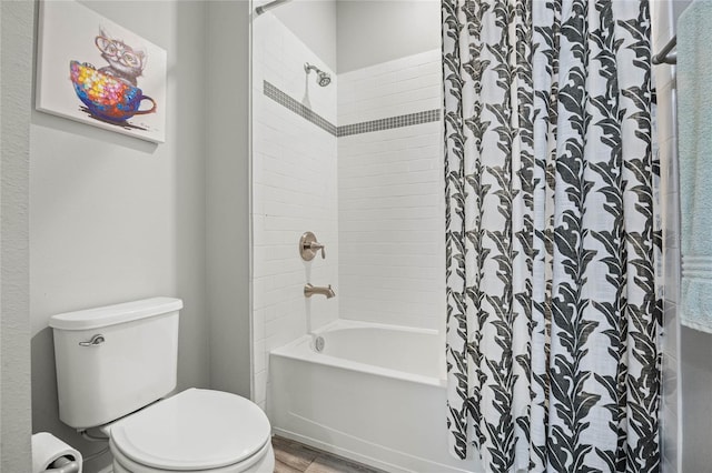 bathroom featuring shower / bath combo, toilet, and wood finished floors