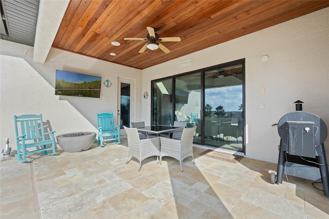 view of patio / terrace featuring outdoor dining area and ceiling fan